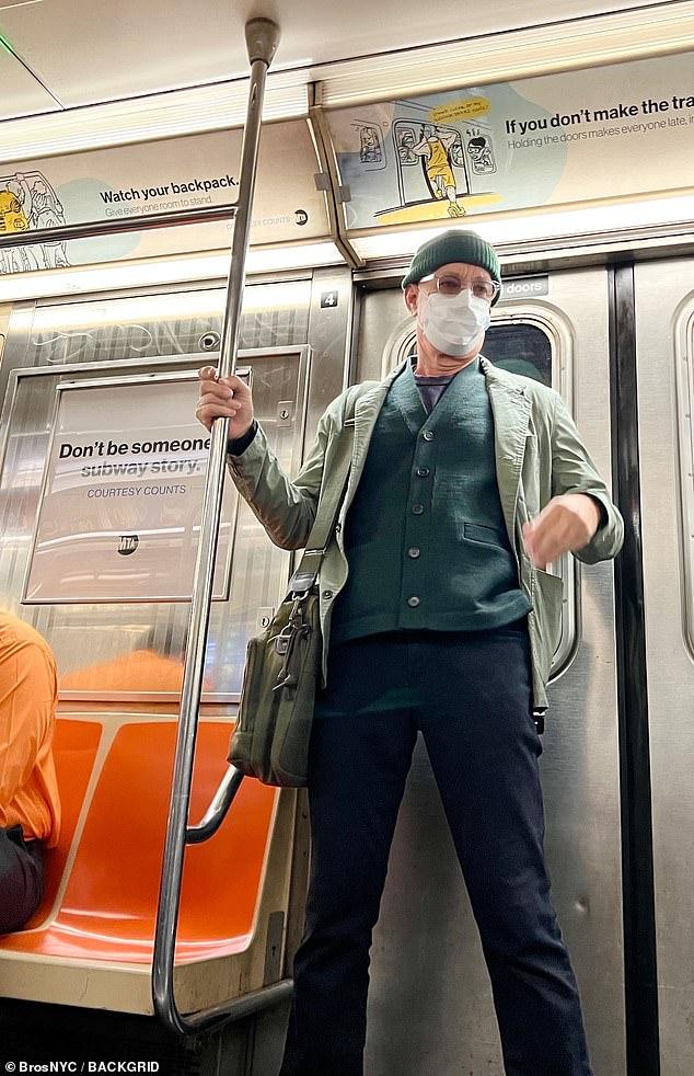 News Room : Hollywood star Tom Hanks goes incognito in a mask as he rides the subway in New York City