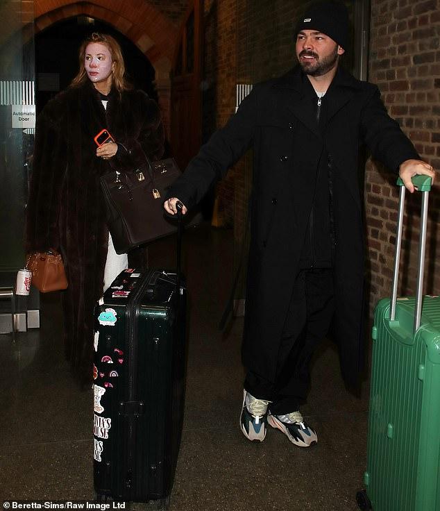 News Room : Olivia Attwood wears a sheet mask on her face as she and husband Bradley Dack catch an early train to Paris for a romantic trip after their marital woes