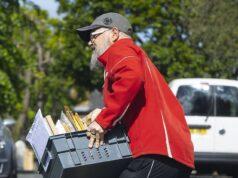 News Room : Keep very still and you might just spot him… the very busy British postman delivering crates of David Attenborough’s 100th birthday cards