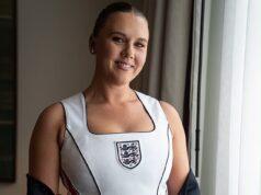 News Room : Kate Kane poses in custom England ‘corset’ ahead of Three Lions’ match in Mexico – as WAGs and fans wait for delayed match to kick off