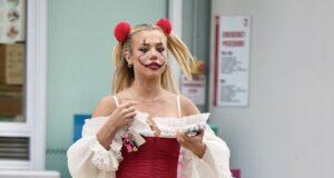 News Room : Tammy Hembrow turns heads in a racy red corset while taking her kids trick-or-treating for Halloween