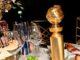 News Room : $125 Golden Globes menu leaves sour taste: Truth about Nobu dishes celebrities a guzzling down Elegant table setting with sushi, a gold award, and assorted dishes for a sophisticated dining experience.