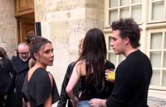 News Room : Another awkward moment between Victoria Beckham and Nicola Peltz goes viral as fans claim Brooklyn’s mum ‘is not the problem’ Discussions among stylish young adults at an outdoor event in a historic city setting.
