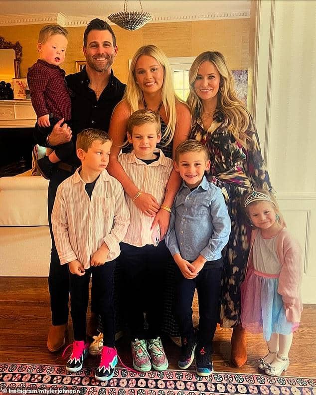 News Room : Bachelorette star Emily Maynard becomes a grandmother Happy family portrait of parents, kids, and baby celebrating indoors in bright, cozy home.