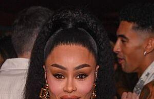 Stunning woman in stylish black dress with fur accents at a social event in Sri Lanka.