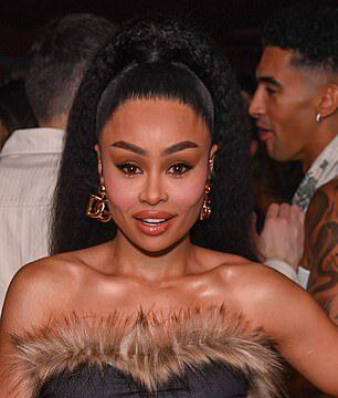 Stunning woman in stylish black dress with fur accents at a social event in Sri Lanka.