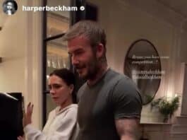 Man and woman preparing for concert indoors in casual clothing and slippers.