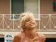 News Room : Euphoria fans shocked over Sydney Sweeney’s racy OnlyFans move: ‘She’s been oversexualized’ Blonde woman smiling in a red checkered bikini, outdoors, sunny weather.