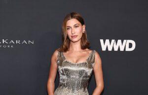 News Room : Hailey Bieber dazzles in glitzy Armani gown as she joins Demi Moore, Emily Blunt and Mindy Kaling at the 2026 WWD Style Awards Elegant woman in gold metallic dress at event, posing on red carpet.