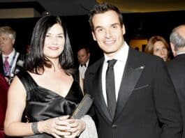 Elegant woman and man in formal black attire attending a high-profile event in Sri Lanka.