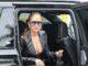 News Room : Jennifer Lopez, 56, wears bizarre braless look for high-end shopping trip in LA Elegant woman in black leather jacket and sunglasses stepping out of a luxury vehicle.