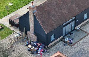 News Room : Katie Price is warned she could be booted out of her swanky new £4.5k-per-month home as neighbours share fears it could become the next ‘mucky mansion’ Overflowing trash bags outside a house, indicating improper waste management.