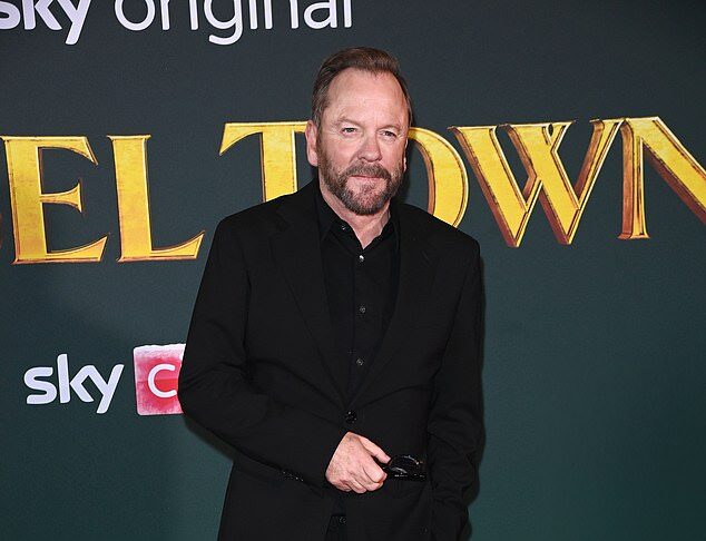Elegant man in black suit at a red carpet event for a movie premiere in Sri Lanka.