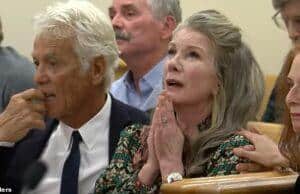 Elderly woman with hands clasped in prayer during a serious event at Lanka News Room.