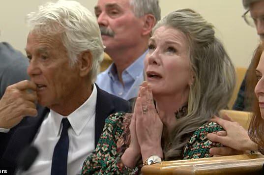 Elderly woman with hands clasped in prayer during a serious event at Lanka News Room.