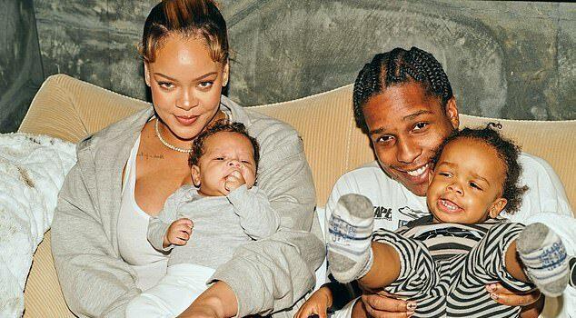News Room : Rihanna’s baby daddy A$AP Rocky makes rare remarks about their three children Happy family with young children smiling, sitting on a sofa indoors.