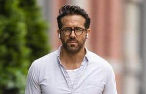 News Room : Ryan Reynolds TORCHED by fans over ‘cringe’ email he allegedly sent to It Ends With Us author Colleen Hoover Stylish man walking outdoors in casual attire on city street.