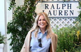 News Room : Samantha Armytage wears a VERY expensive watch and diamonds as she puts on a very chic display at the Australian Open Elegant woman in Ralph Lauren outfit at shopping mall or boutique, smiling and holding a handbag.