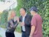 News Room : Thora Birch asks autograph seeker if he’s ‘from Israel’ in tense confrontation after BAFTA Tea Party Distressed woman arguing with man on sidewalk, angry confrontation outside house, tension between individuals over a dispute.