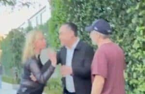 News Room : Thora Birch asks autograph seeker if he’s ‘from Israel’ in tense confrontation after BAFTA Tea Party Distressed woman arguing with man on sidewalk, angry confrontation outside house, tension between individuals over a dispute.