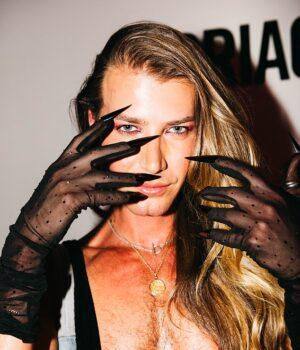 News Room : Christian Wilkins bares chest and dons long sheer gloves with razor sharp nails as he steps out in edgy ensemble at Peggy Gou’s VIP DJ set in Sydney News Room Christian Wilkins bares chest and dons long