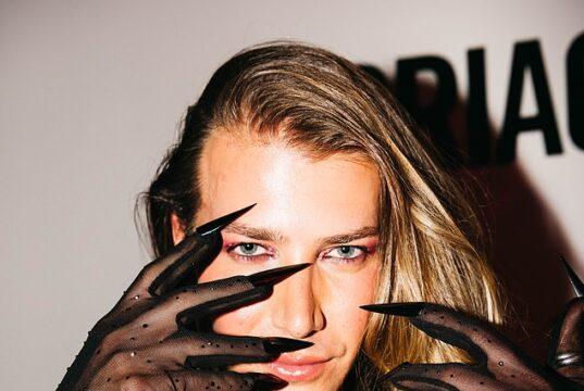 News Room Christian Wilkins bares chest and dons long