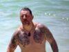 News Room : Shirtless My Kitchen Rules star Manu Feildel shows off his extensive tattoo collection after getting MORE ink as he hits the beach for a sweet outing with his mother News Room Shirtless My Kitchen Rules star Manu Feildel