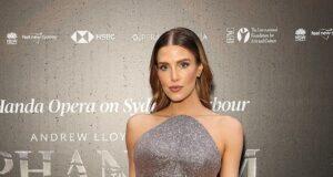 News Room : Erin Holland puts on a leggy display with a soaring thigh split gown as she leads arrivals at the opening night of The Phantom of the Opera in Sydney