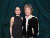 News Room : Mick Jagger, 82, wraps an arm around braless fiancee Melanie Hamrick, 38, at starry pre-Oscars bash News Room Mick Jagger 82 wraps an arm around