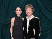 News Room : Mick Jagger, 82, wraps an arm around braless fiancee Melanie Hamrick, 38, at starry pre-Oscars bash News Room Mick Jagger 82 wraps an arm around