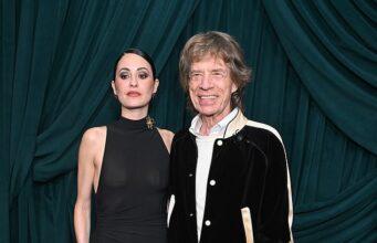 News Room : Mick Jagger, 82, wraps an arm around braless fiancee Melanie Hamrick, 38, at starry pre-Oscars bash News Room Mick Jagger 82 wraps an arm around