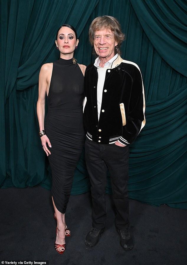News Room : Mick Jagger, 82, wraps an arm around