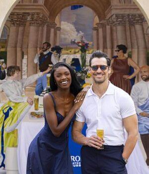 News Room David Gandy and Leomie Anderson pour beers